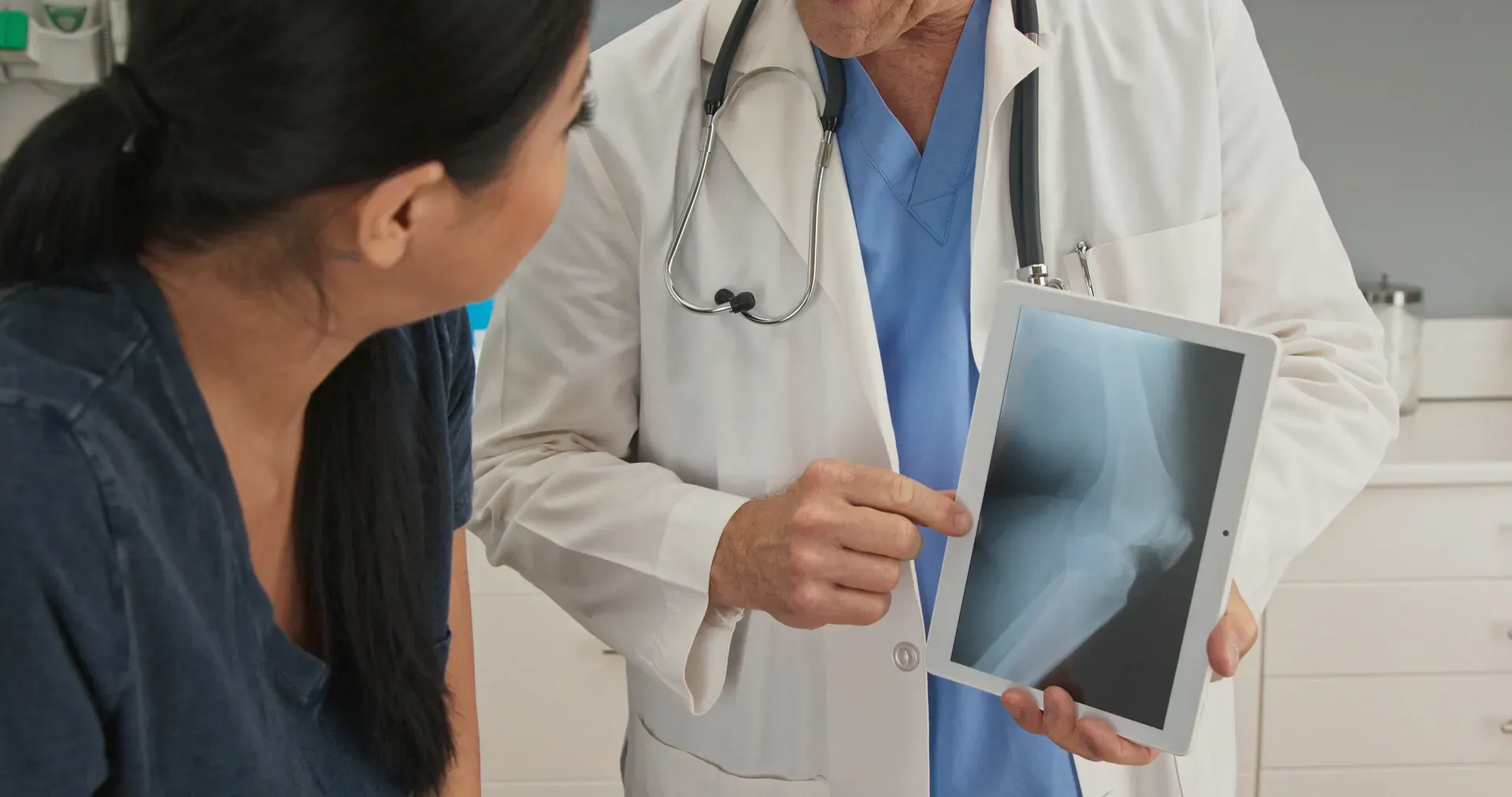 Doctor reviewing x-ray with a patient
