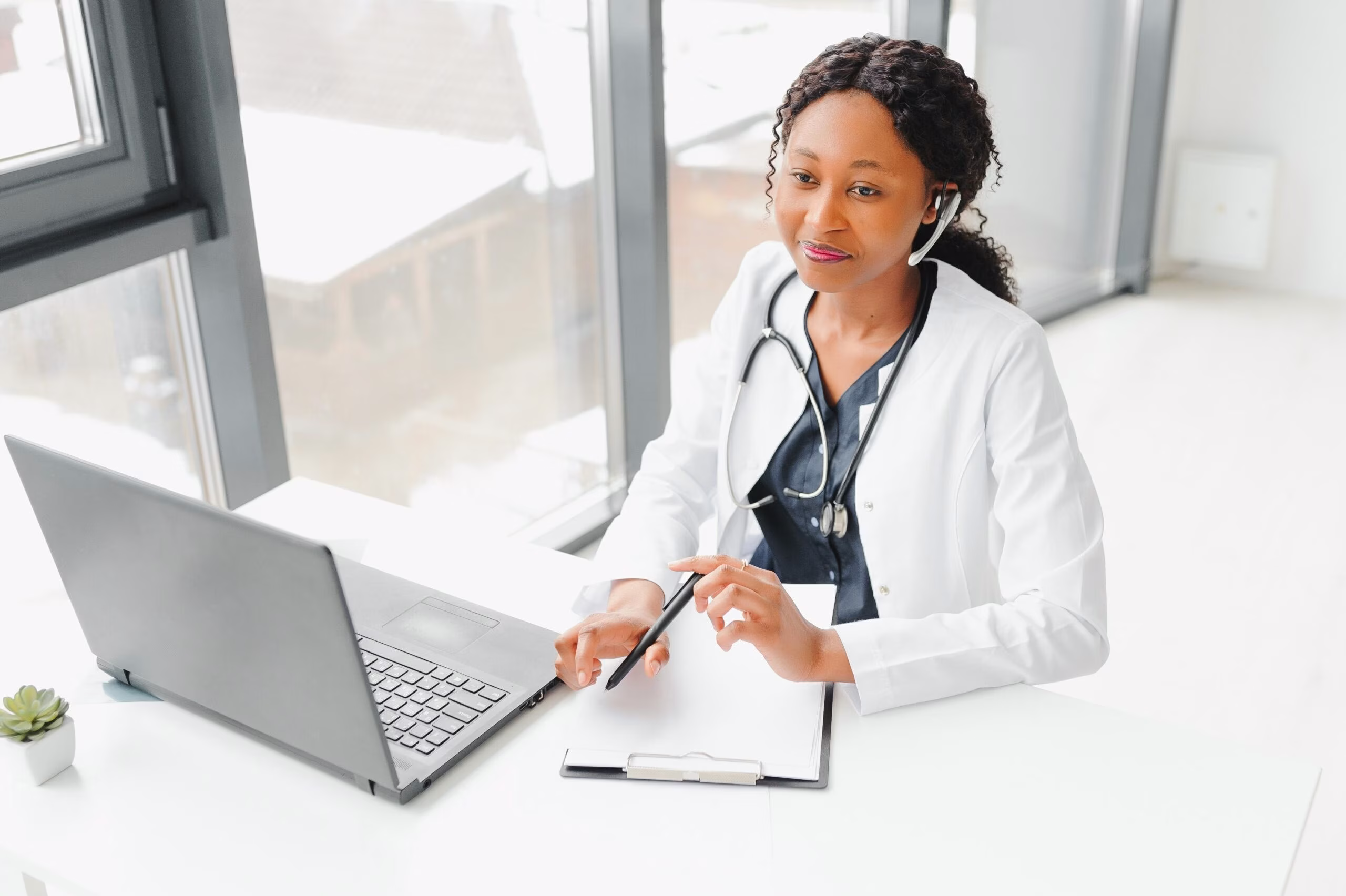 Telehealth, provider in headset consulting with the patient over the phone call