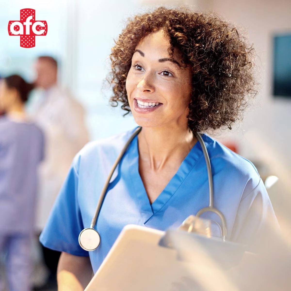 Female physician smiling while talking to a patient