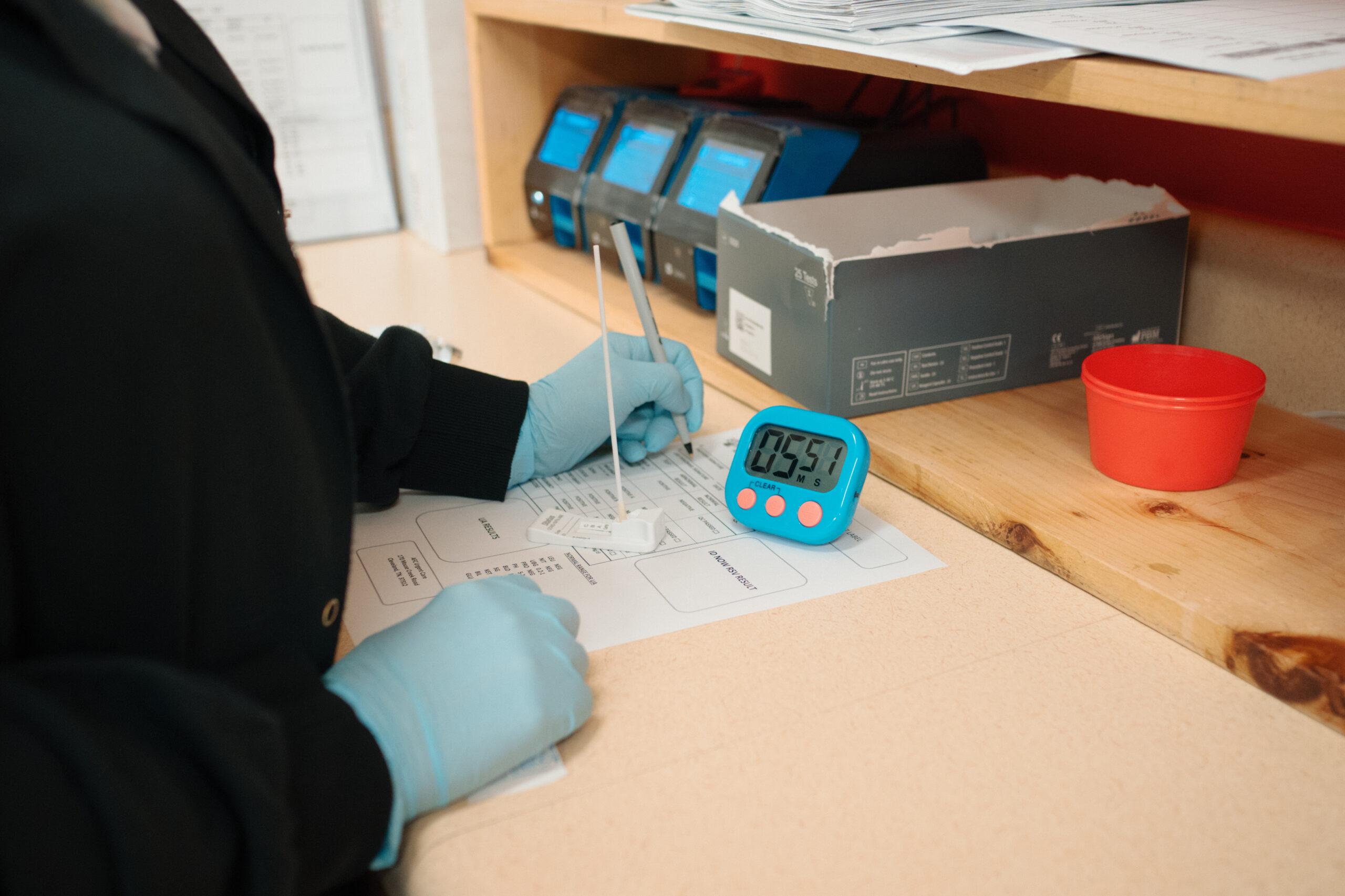 AFC technician charting labs given on-site at an AFC urgent care clinic location. 