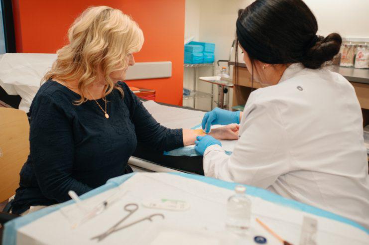 Female Patient Receiving Stitches at AFC Vancouver