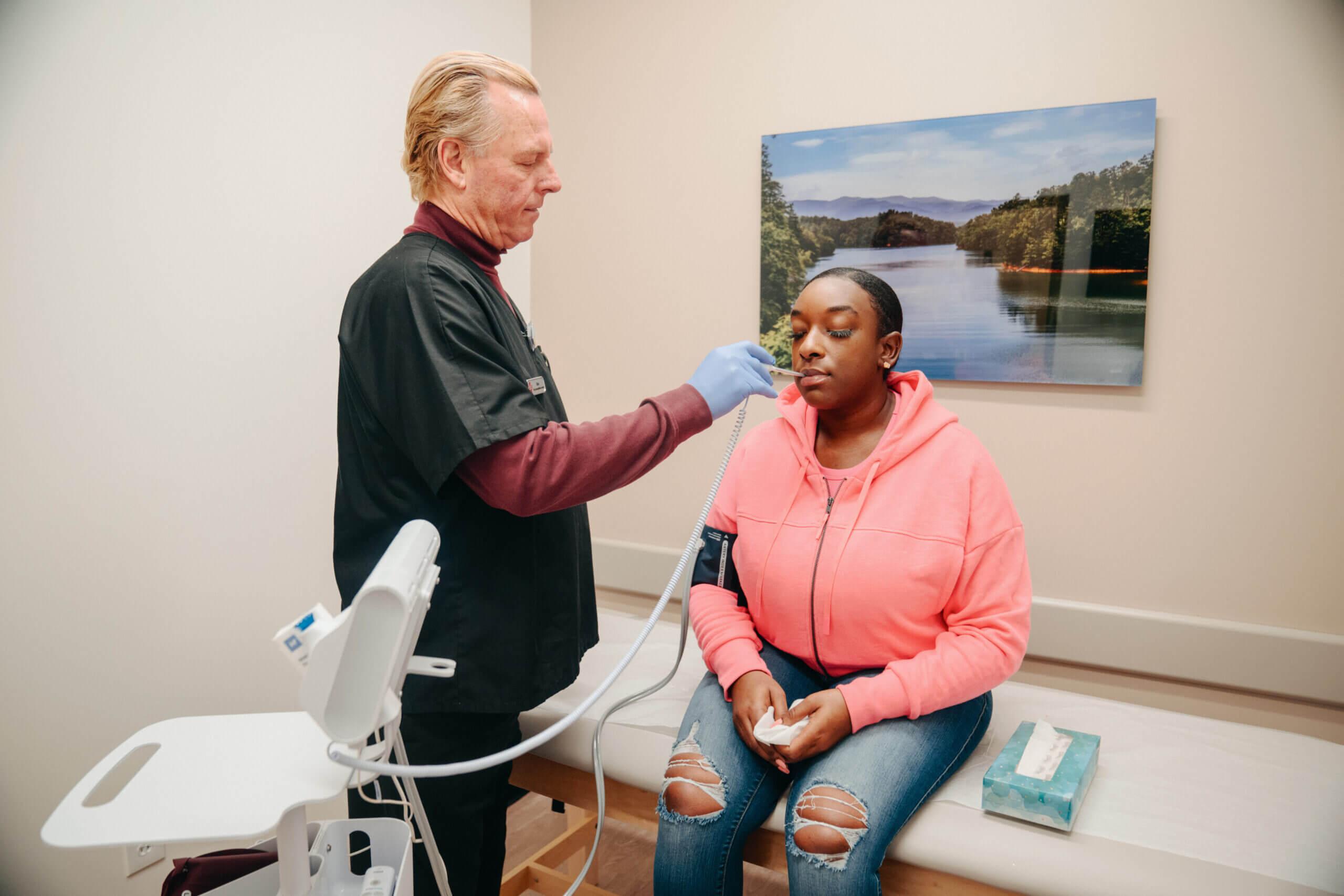 Woman receiving care for an illness in an urgent care