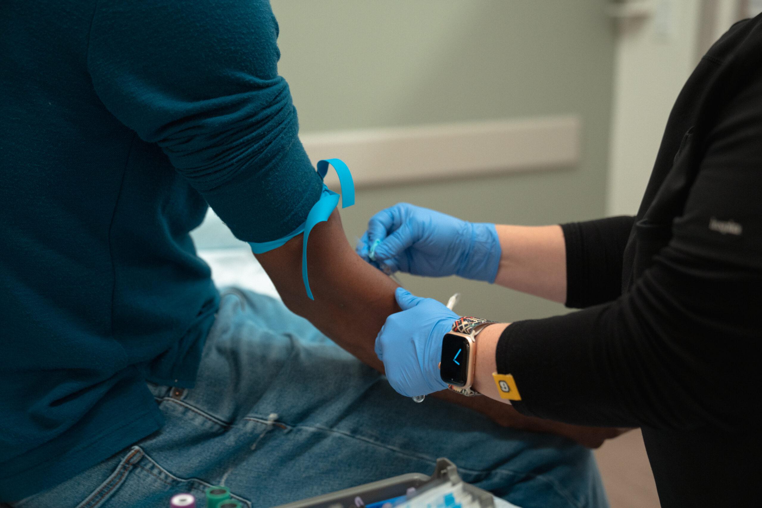 Man having blood drawn for an STD panel