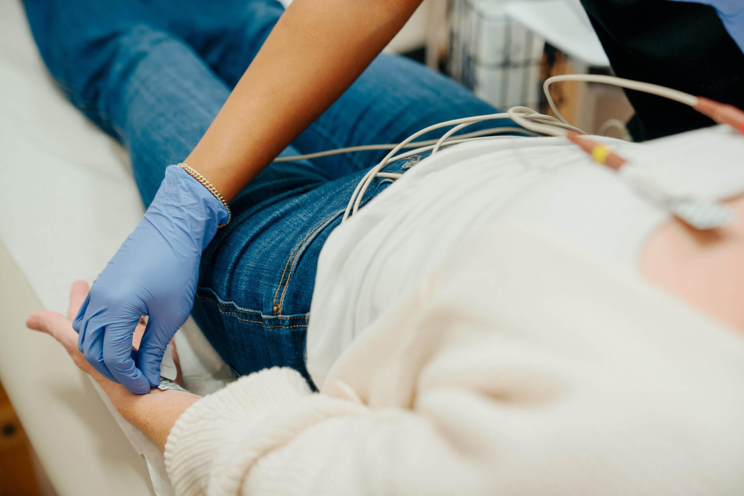 Doctor performing EKG on patient