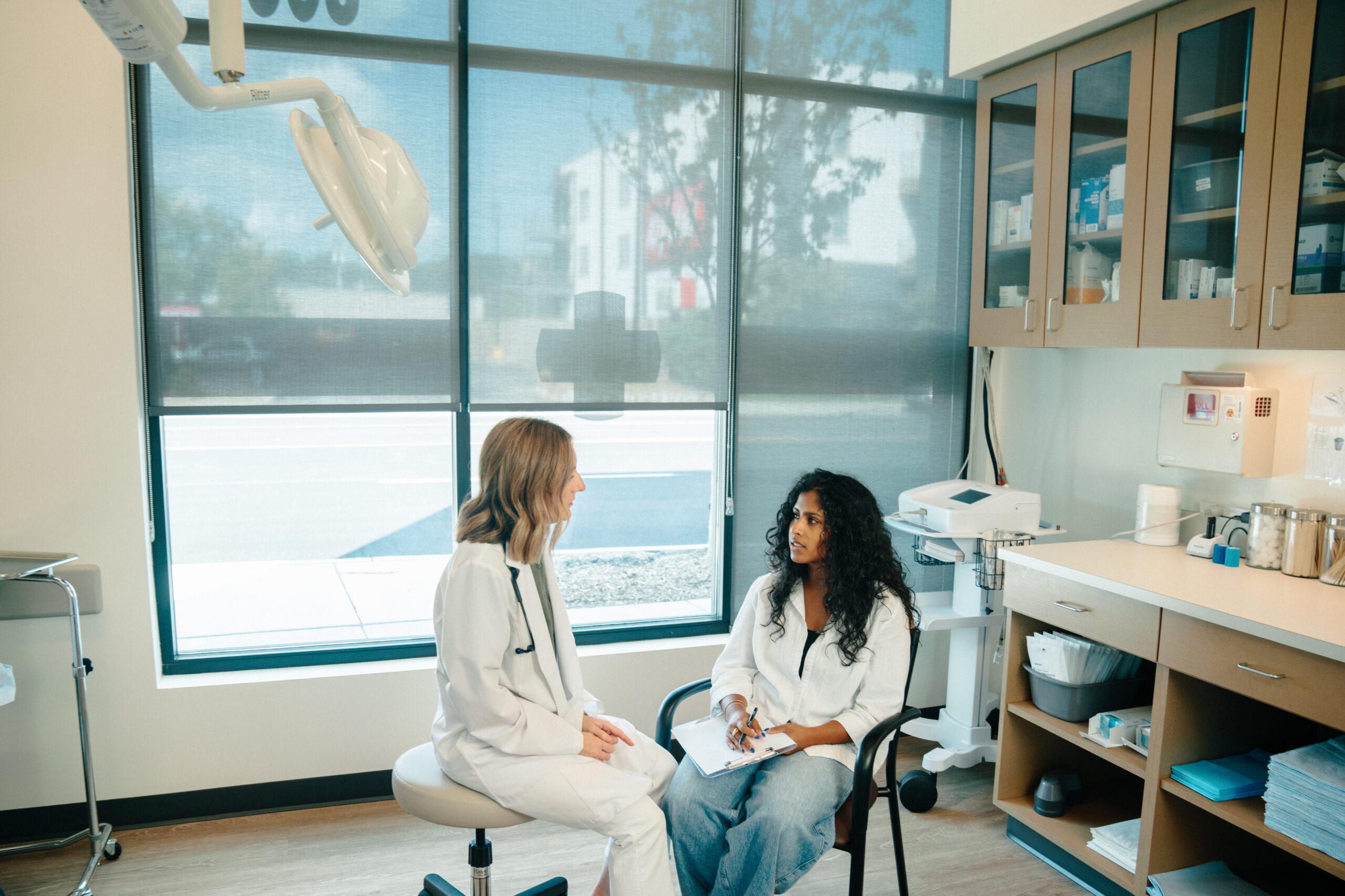 AFC health care provider helps young woman with UTI.
