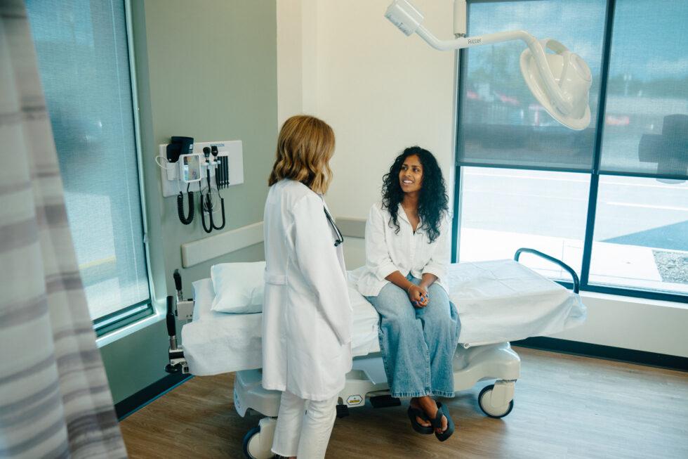 AFC provider talking with a patient about long COVID.