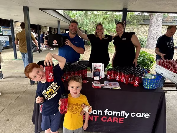 AFC Urgent Care Lenoir booth at a local festival in Caldwell County.