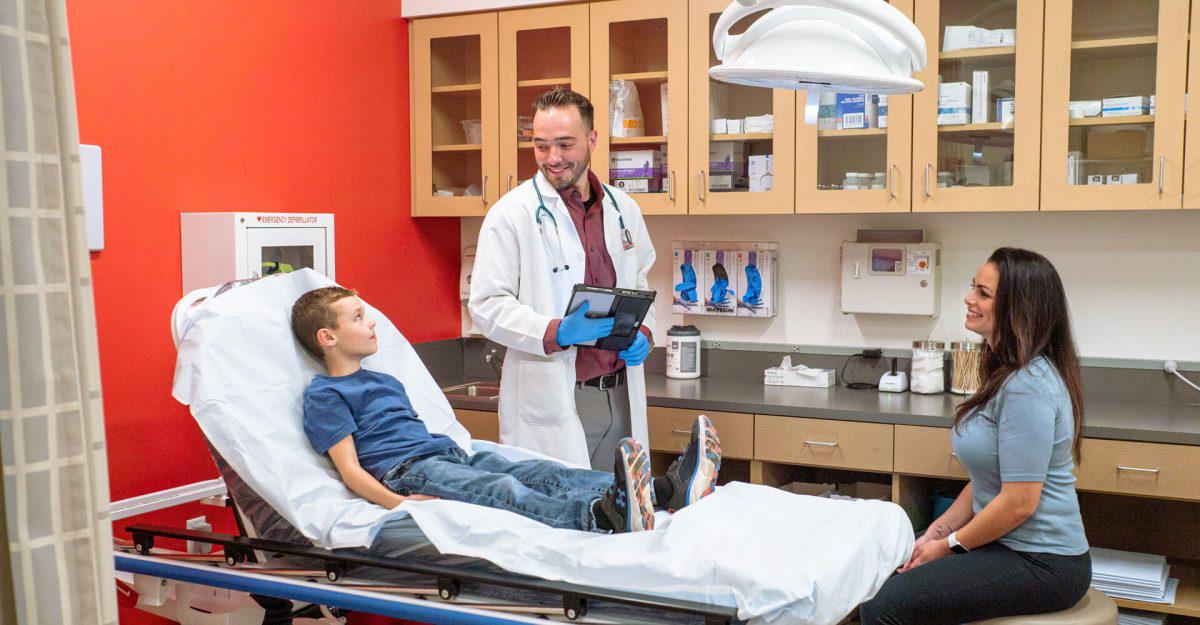 AFC provider examining child patient