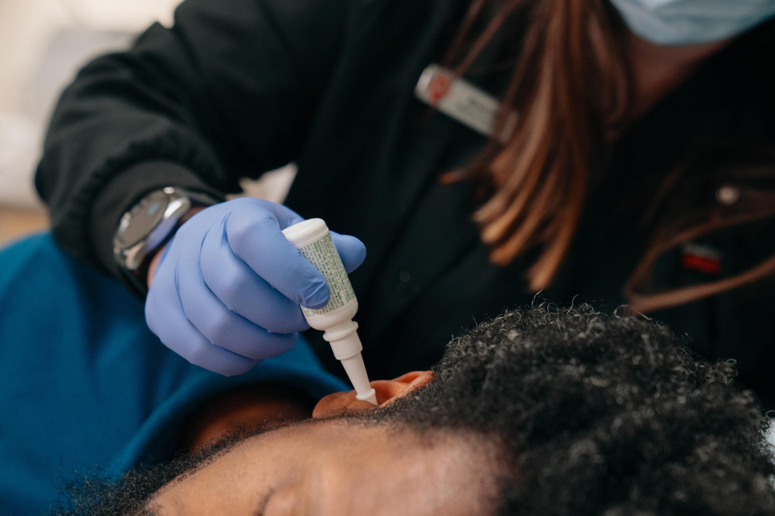 Ear cleaning at AFC Raleigh-Brier Creek