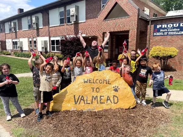 AFC Urgent Care Lenoir donating field day supplies to Valmead elementary school