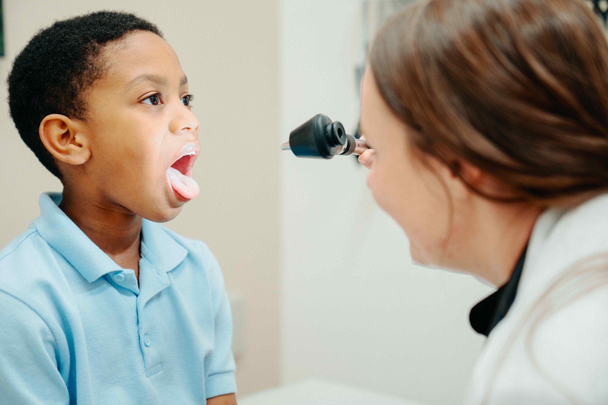 Young child receiving a breathing treatment from an AFC provider during a pediatric urgent care visit at AFC Broadway, CO.